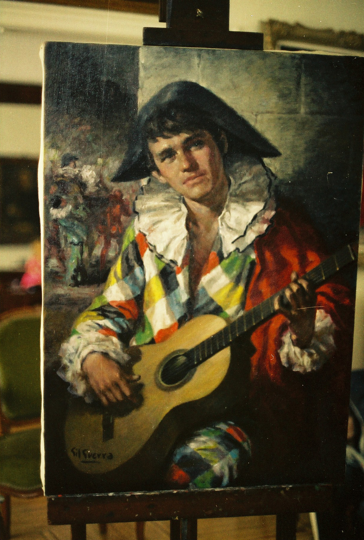Arlequín con guitarra